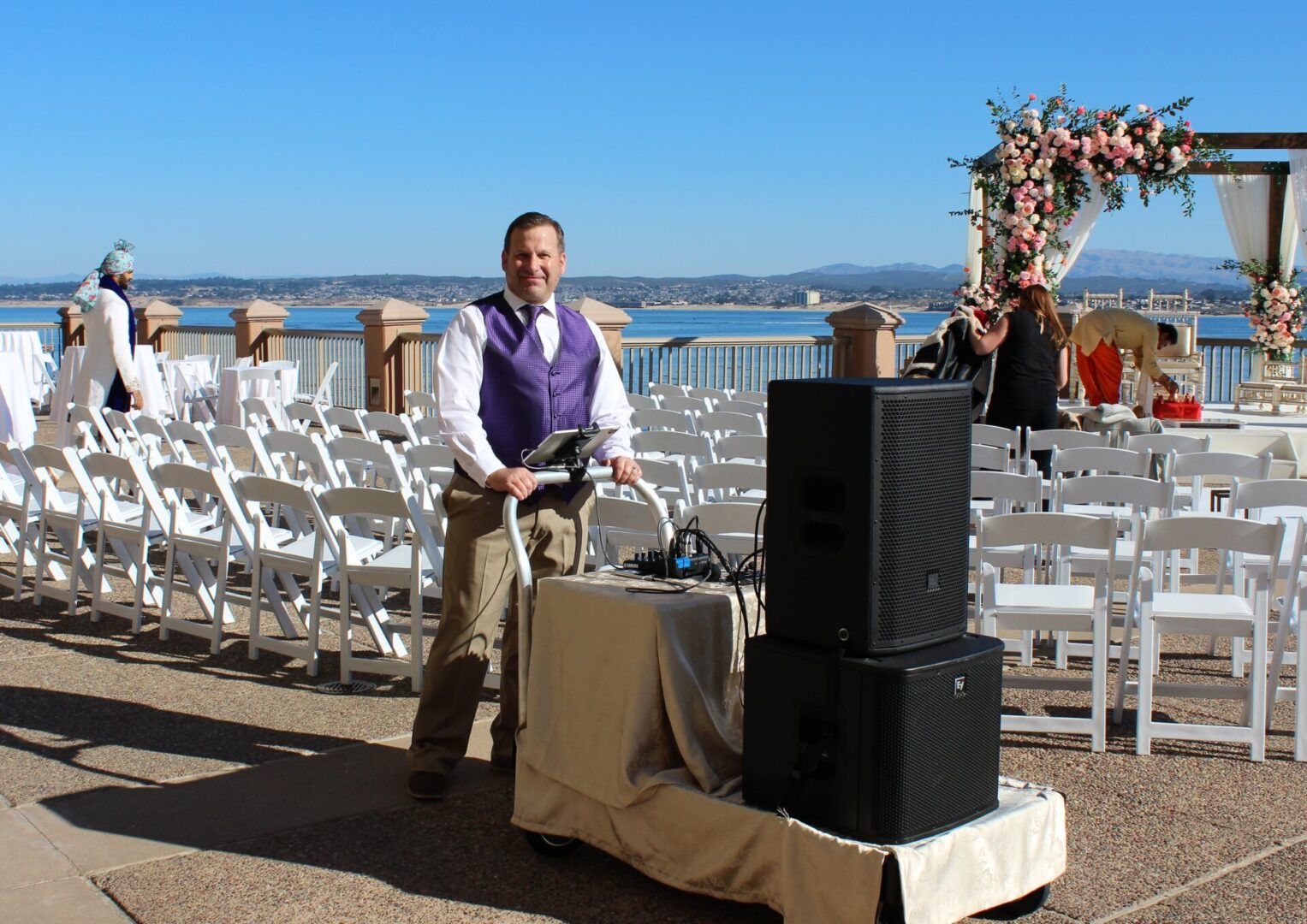 DJ Justin Warwick owner of DJ Enterprises Mobile Disc Jockey with his premium battery powered 1,200 Watt mobile sound system for an Indian Baraat Procession in Monterey California. The Monterey Plaza Hotel