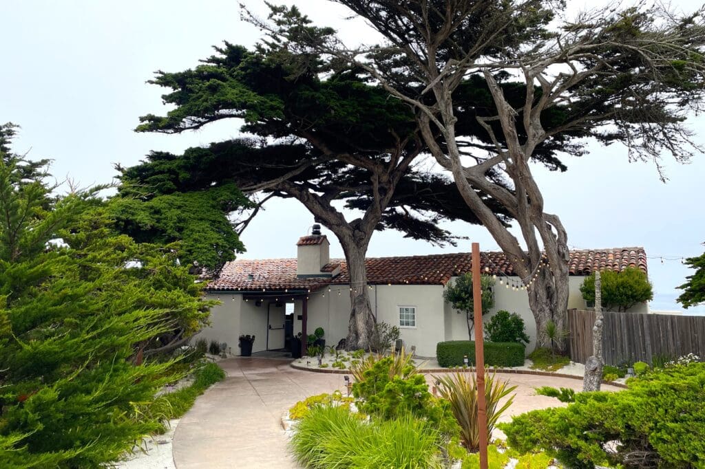 Monterey Peninsula Country Club Beach House courtyard. Wedding DJs in Pebble Beach, California. Beach wedding ceremony | Local Pebble Beach Wedding DJs | Monterey Wedding DJs | LGBTQ+ wedding DJs | LGBTQ+ weddings in Pebble Beach, CA. | DJ Justin Warwick, DJ Enterprises Mobile Disc Jockey | Pebble Beach Wedding Entertainment