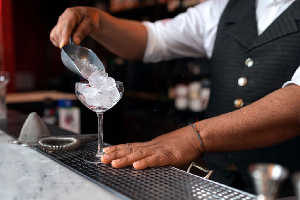 Bartender filling a glass with ice for a drink | wedding bartender | wedding DJ