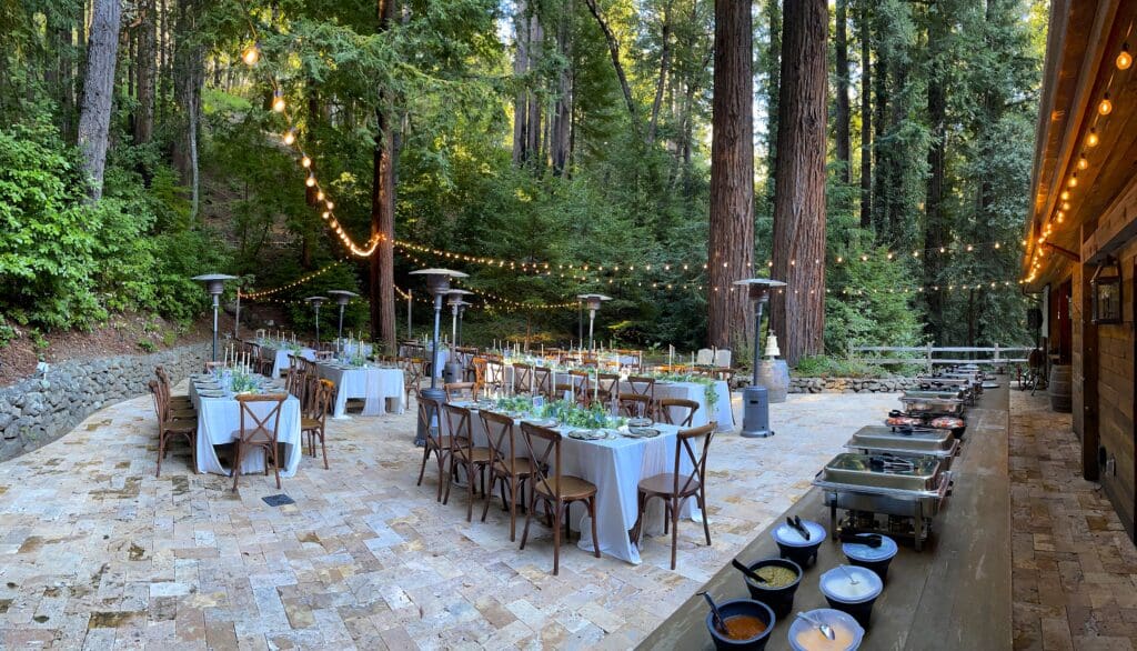 Wedding dinner service on the patio at Waterfall Lodge and Retreat, Ben Lomond, California | The Redwood Cathedral, outdoor wedding ceremony site. Ben Lomond wedding DJs | Santa Cruz wedding DJs | music by DJ Enterprises Mobile Disc Jockey & photo booth