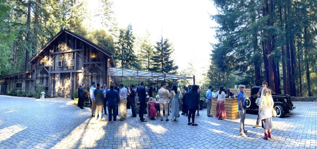 Wedding Cocktail hour on the patio at Waterfall Lodge and Retreat, Ben Lomond, California | The Redwood Cathedral, outdoor wedding ceremony site. Ben Lomond wedding DJs | Santa Cruz wedding DJs | music by DJ Enterprises Mobile Disc Jockey & photo booth