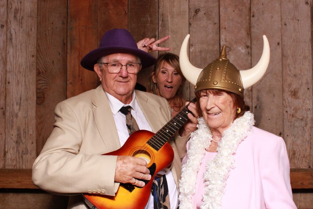Icebreaker Photo Booth @ Waterfall Lodge and Retreat with wood wall as a Backdrop | Santa Cruz Wedding DJ | Ben Lomond wedding DJs | all inclusive wedding DJ and photo booth package at Waterfall Lodge and Retreat, the "Waterfall Package" | Vintage photo booth rentals in Santa Cruz | Santa Cruz wedding photo booth
